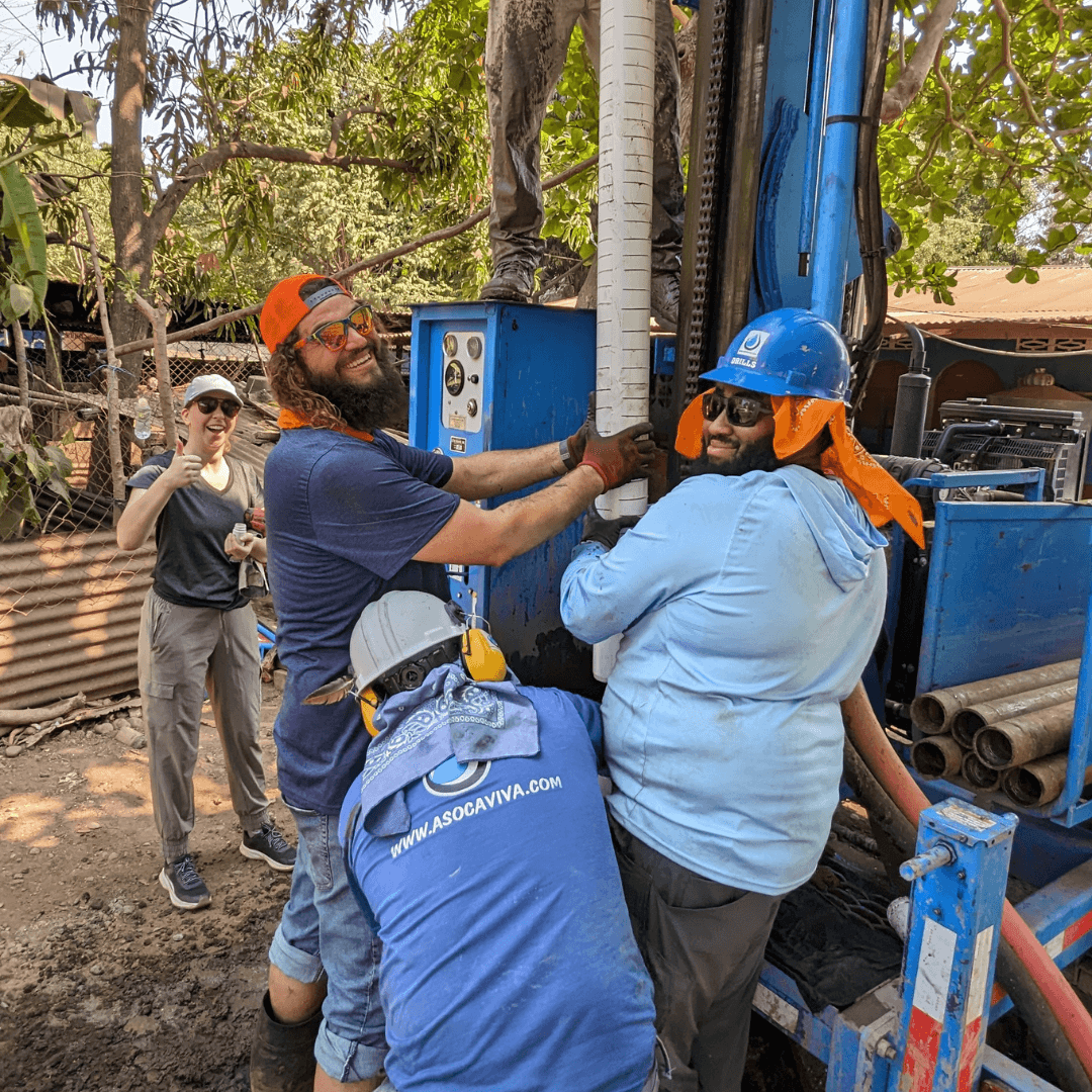 Mark and Jeremy working on installing the well